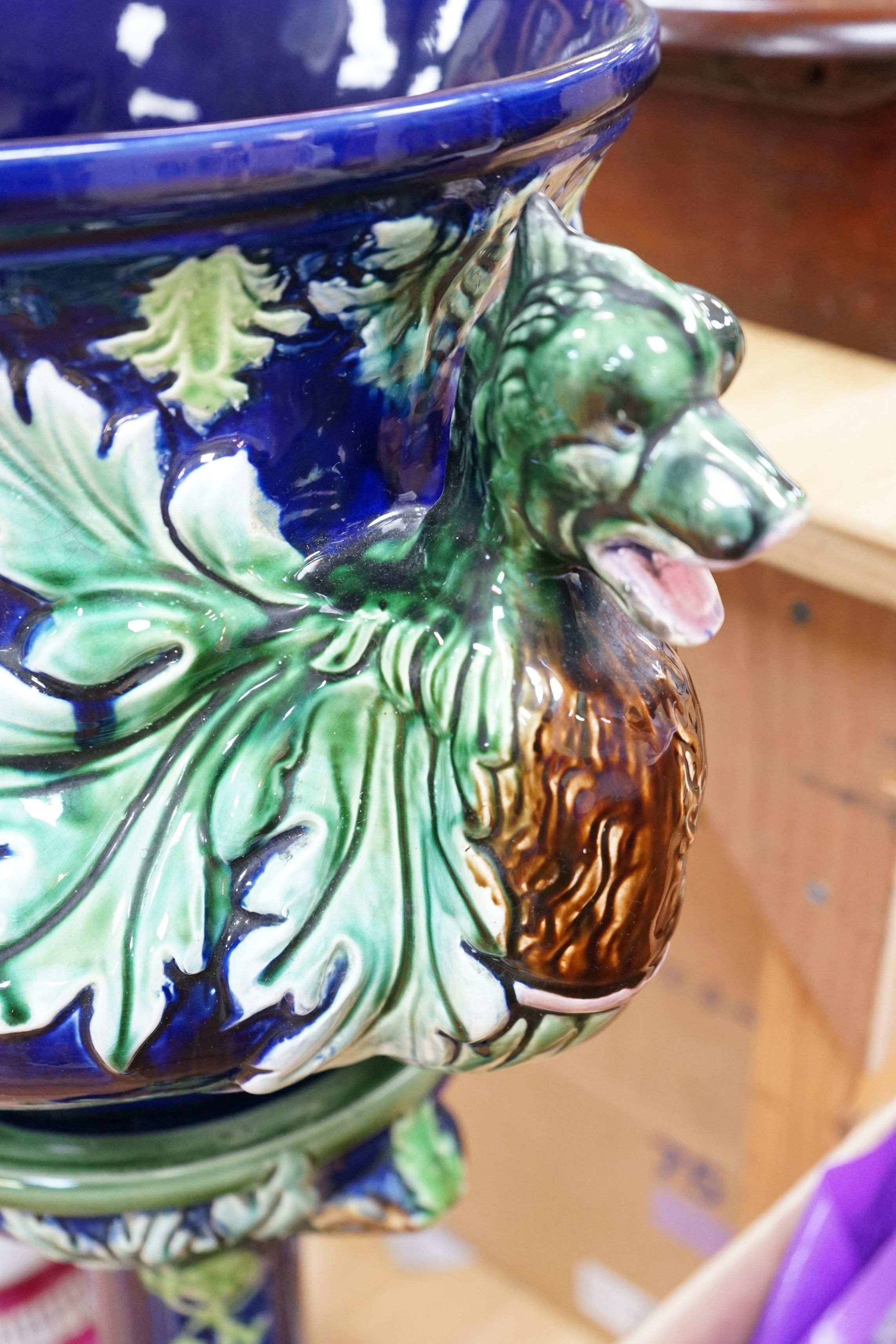 A 19th century majolica jardiniere on pedestal and a two handled jar and cover, jardiniere and stand 99cms high